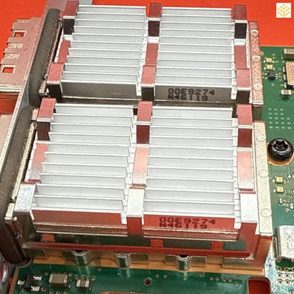 Heat sink with multiple aluminum fins mounted on a circuit board.