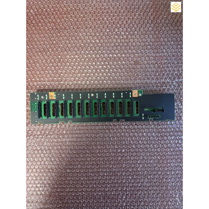 Circuit board with multiple parallel green ports or connectors arranged in a row.