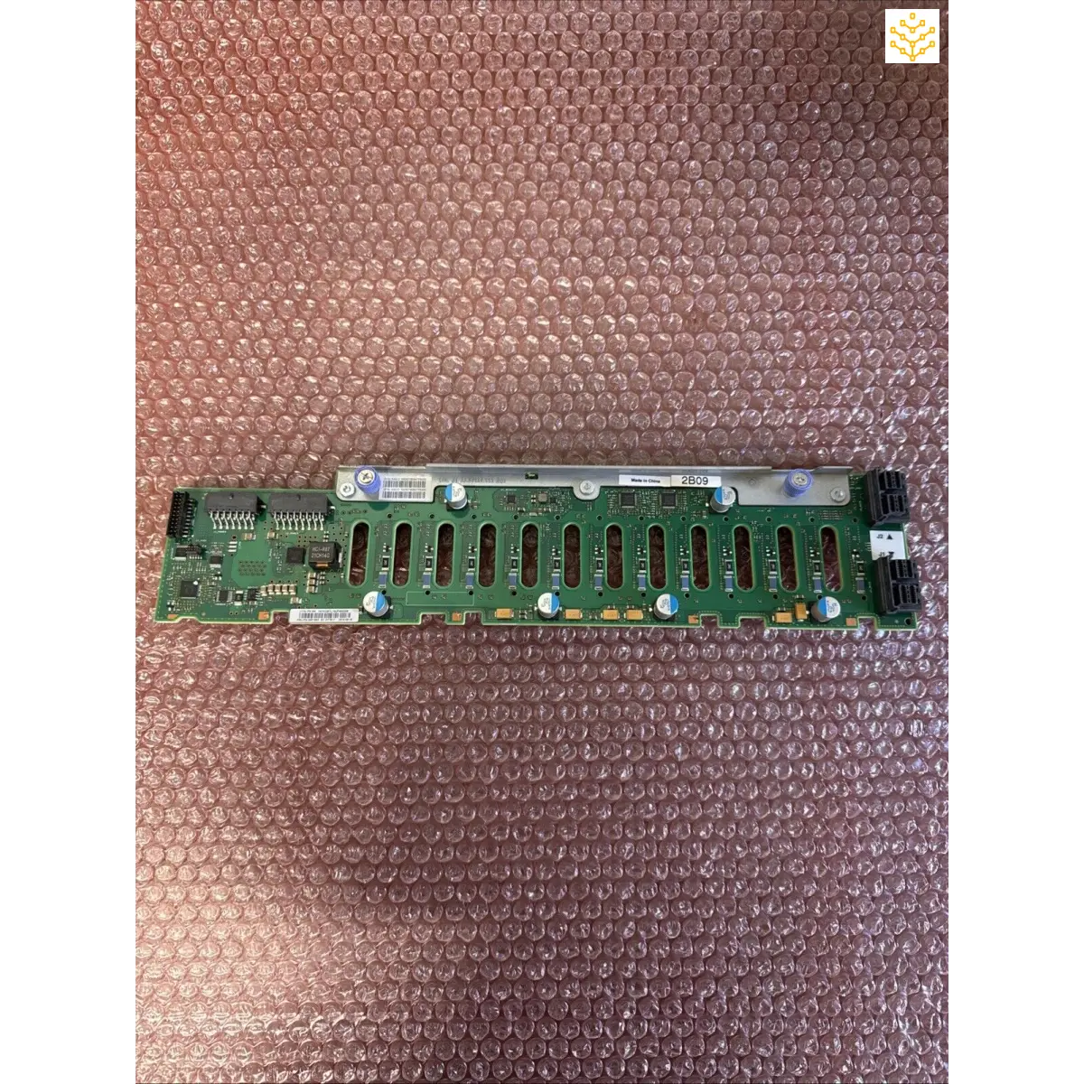 Green circuit board with multiple parallel connector slots.