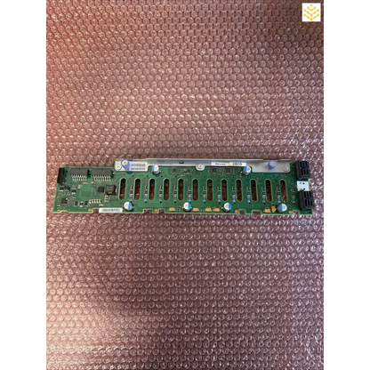 Green circuit board with multiple parallel connector slots.