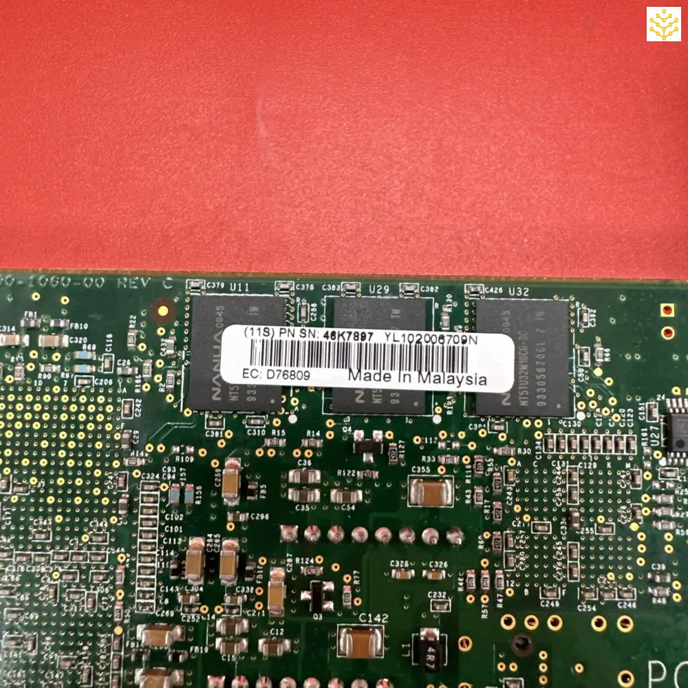 Circuit board with electronic components and a barcode label.