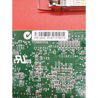 Circuit board with visible electronic components and a barcode.