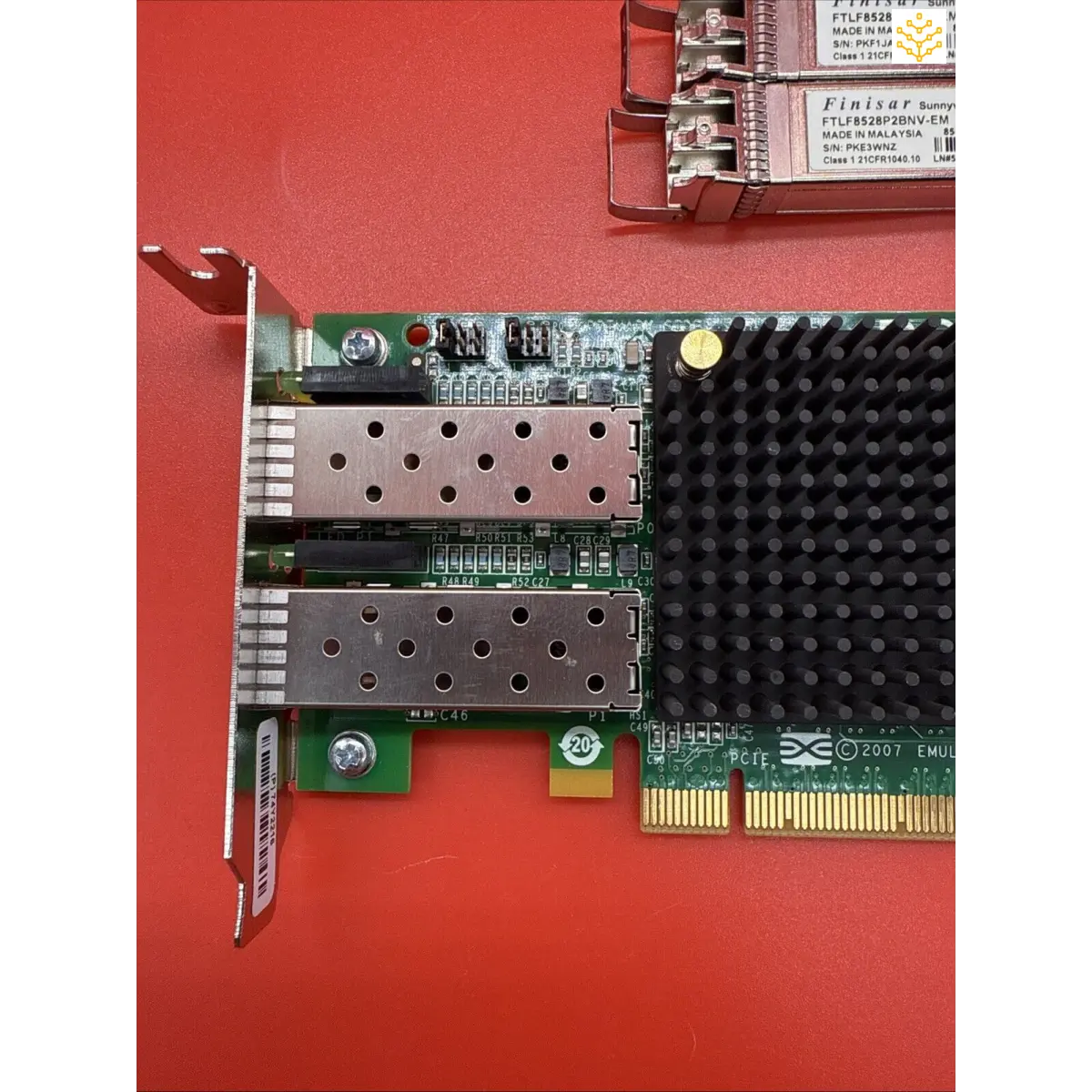 Network interface card with dual SFP ports and PCIe connector.