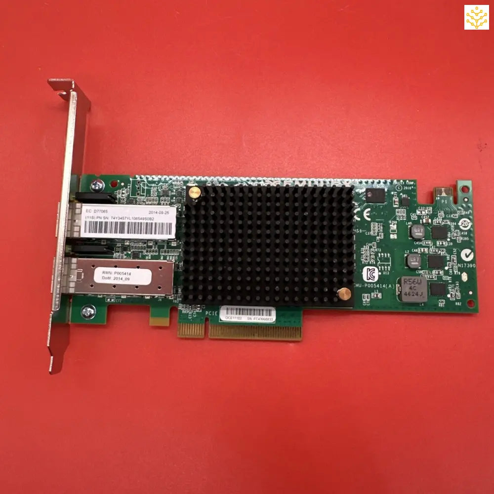 PCIe network interface card with a black heatsink mounted on a green circuit board.