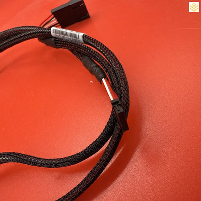 Black braided cable with mesh sleeving and a connector.