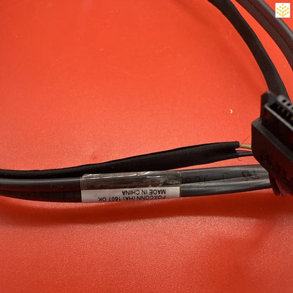 Black electrical cable with printed text label.