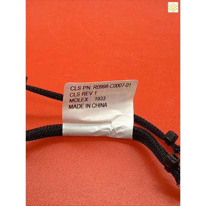 Product label with part number and ’MADE IN CHINA’ text attached to black cord.