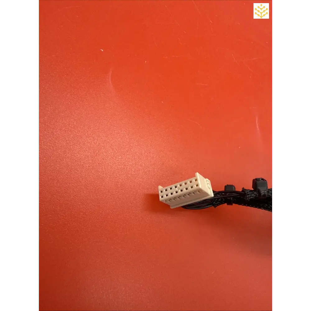 White plastic LEGO brick attached to a black cable.