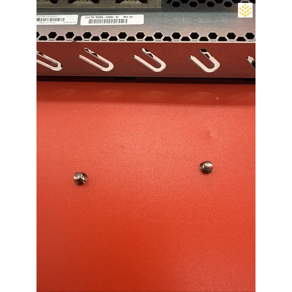 Red metal panel with hook mounts and screws.