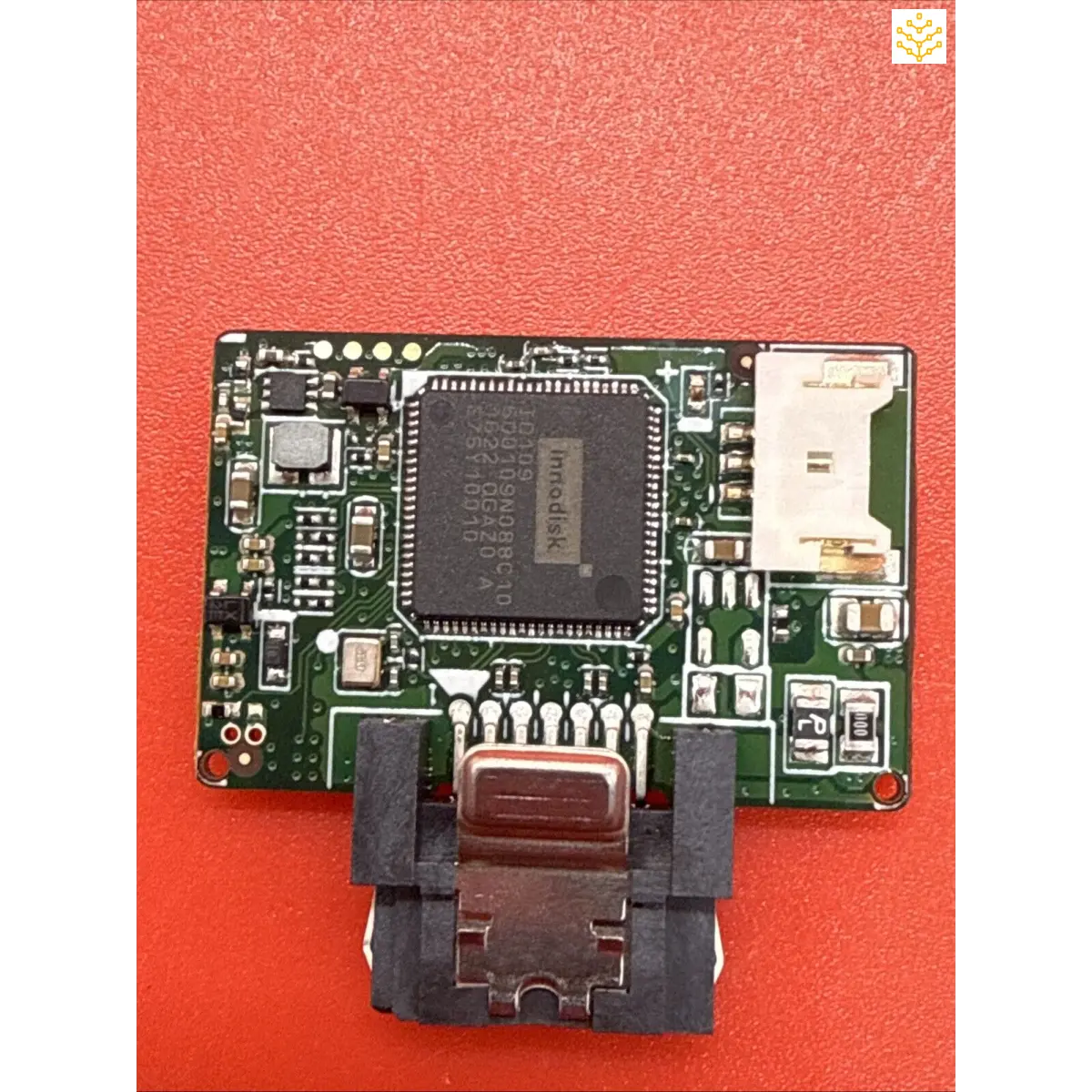 Circuit board with a central processor chip and various electronic components.