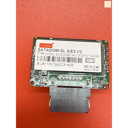 Solid-state drive (SSD) module with visible circuit board and connector.