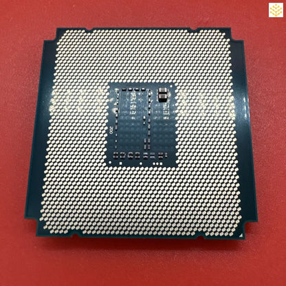 Computer processor chip with visible pin grid array and central processing unit.