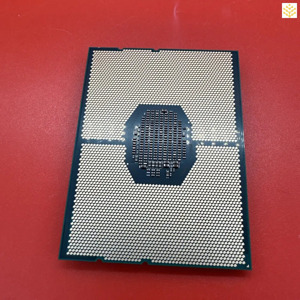 Computer processor chip with a grid-like surface pattern.