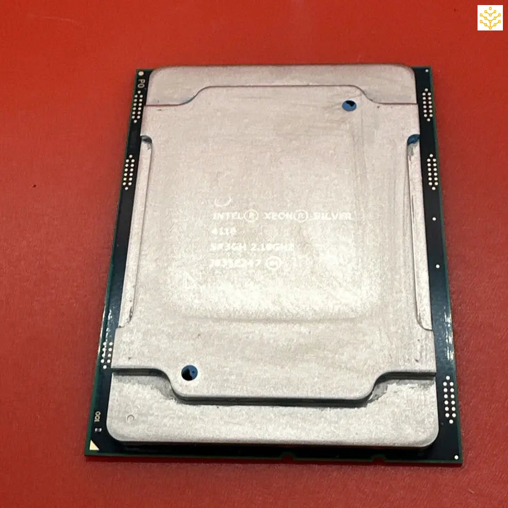 Computer processor chip with a metallic heat spreader on top.