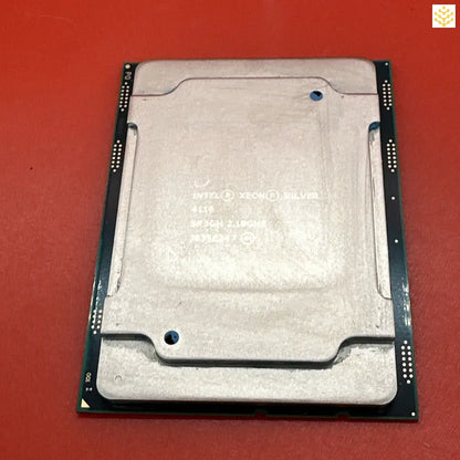 Computer processor chip with a metallic heat spreader on top.