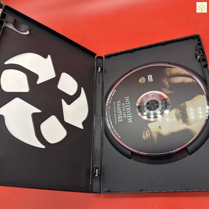 DVD case opened to show a disc and recycling symbol inside.