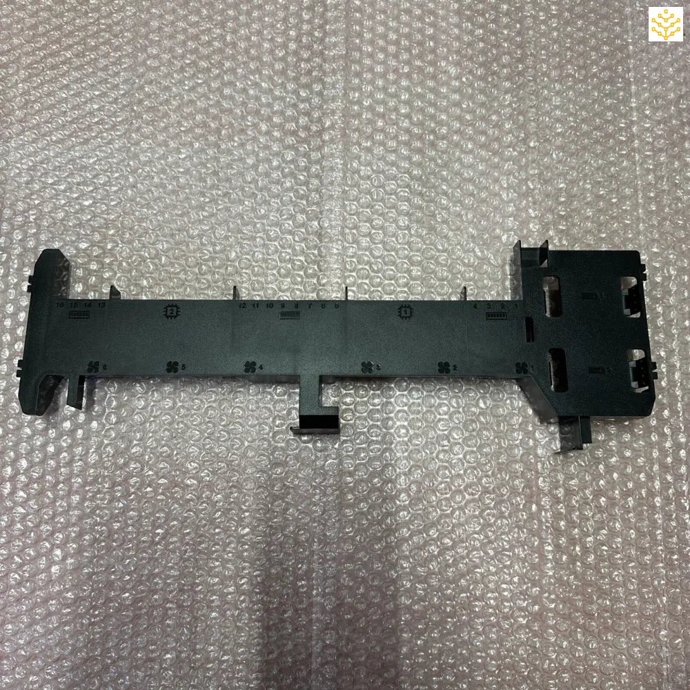 Black plastic internal computer or electronic device component with multiple connection ports.