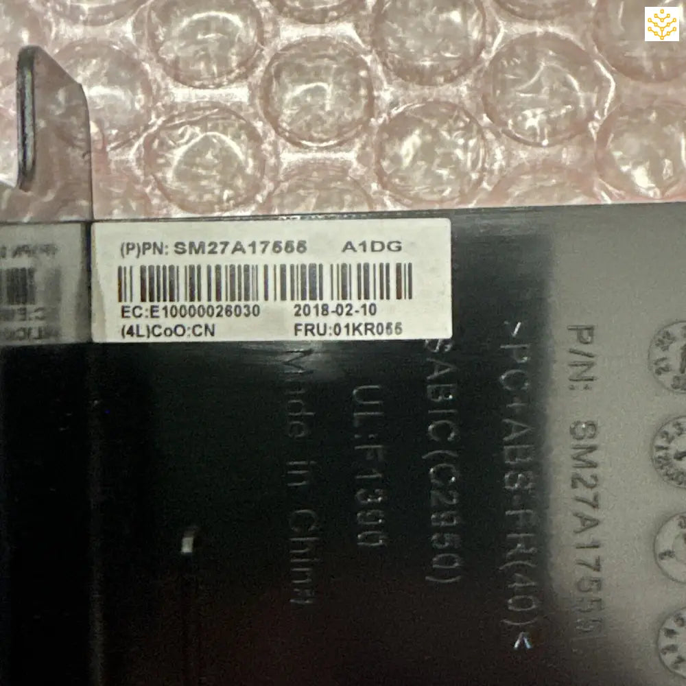 Barcode label with product information on a dark surface.