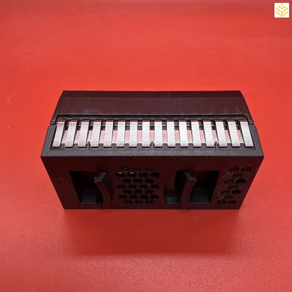 Black electronic keyboard instrument with visible piano keys and speaker grilles.