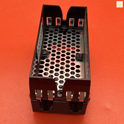 Black plastic component with a honeycomb ventilation pattern and mounting brackets.