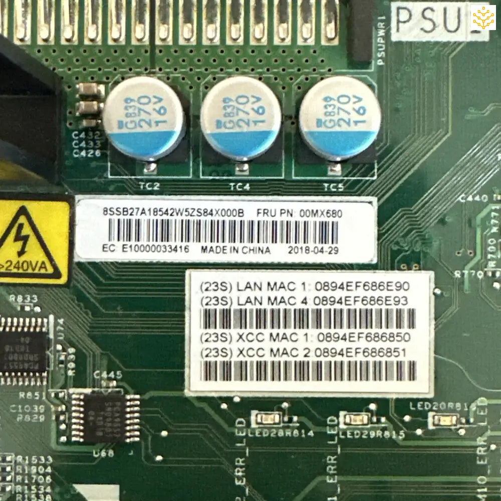 Circuit board with electronic components and identification labels.