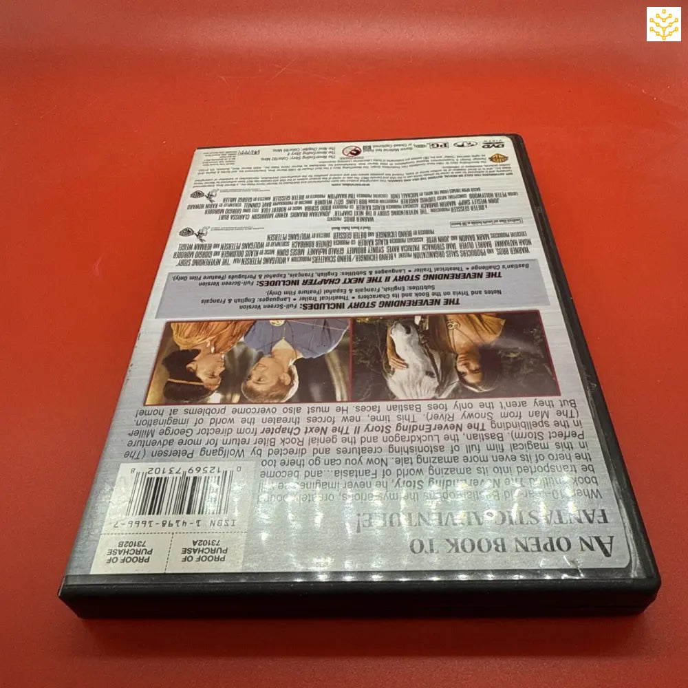 DVD case with text and movie scenes on the back cover.