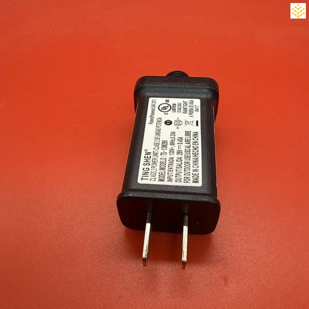 Black electrical power adapter with two prongs.