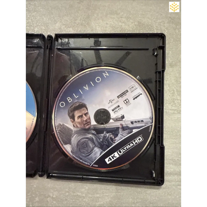 4K Ultra HD Blu-ray disc of the movie ’Oblivion’ inside an open case.