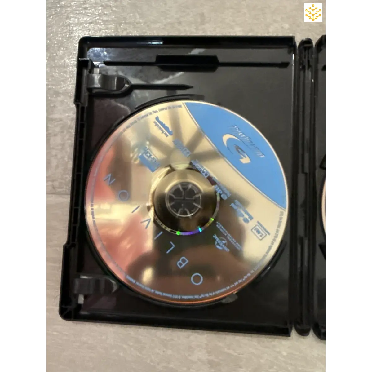 Compact disc (CD) inside an open plastic case.