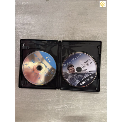 Open DVD case containing two discs, one labeled ’Oblivion’.