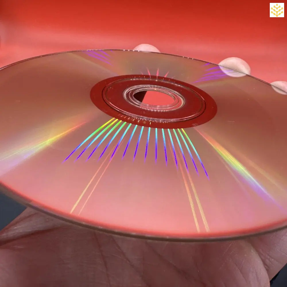 Compact disc (CD) reflecting rainbow colors across its surface.