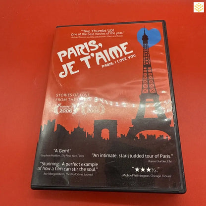 DVD case of the film ’Paris, Je T’aime’ featuring the Eiffel Tower silhouette against an orange-red sky.