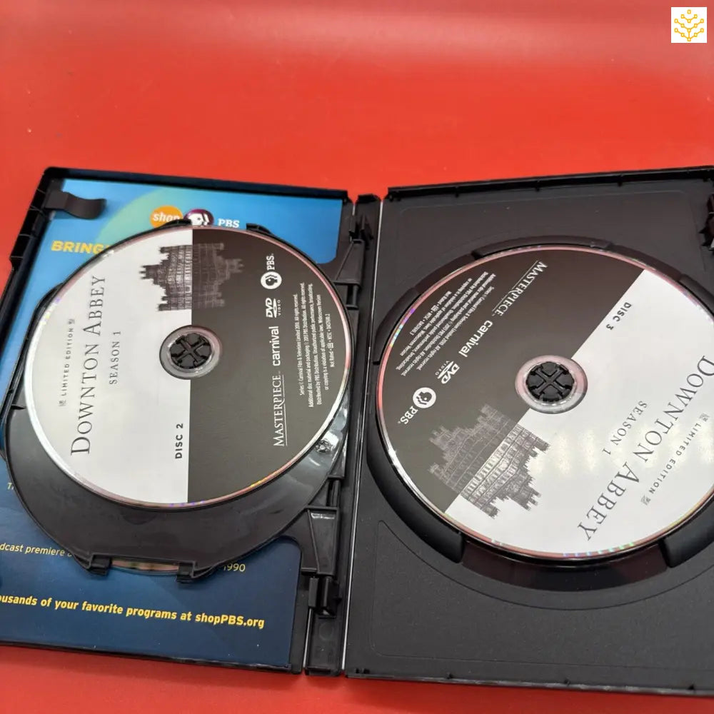 DVD case opened to show two discs inside.