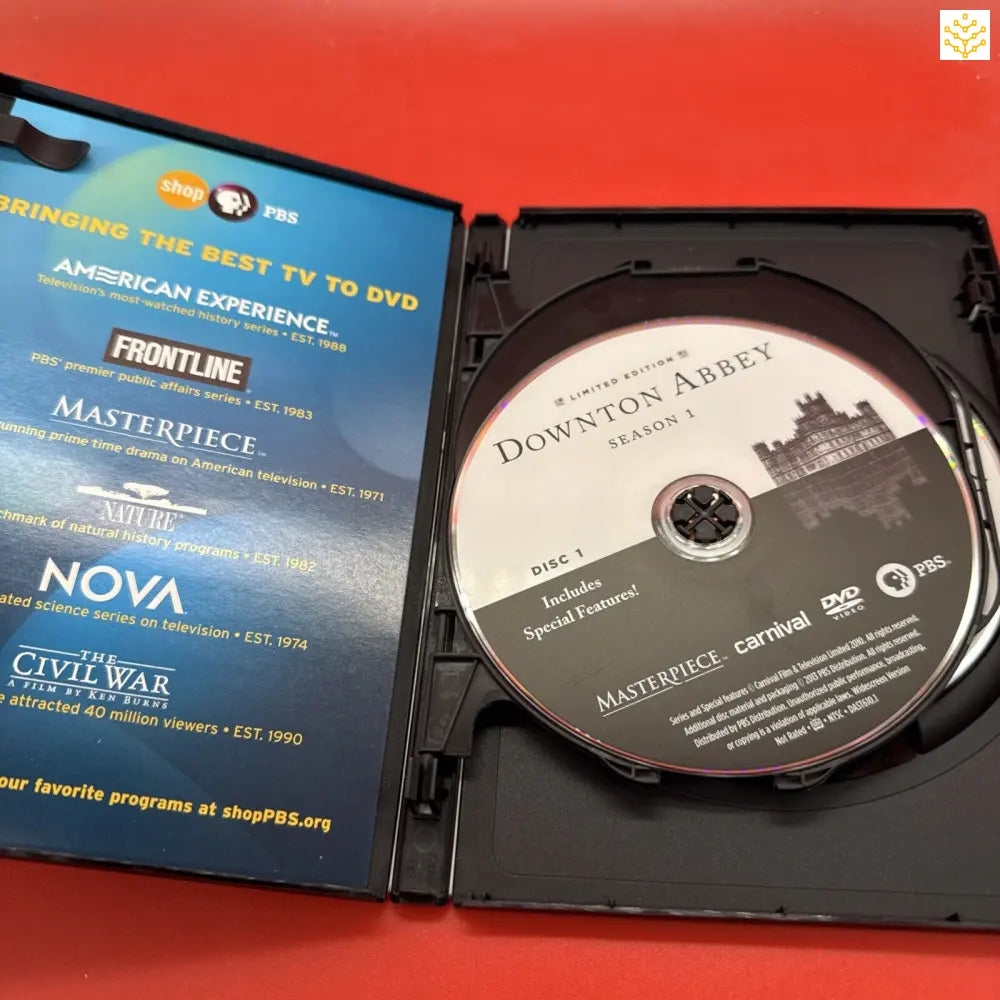 Open DVD case showing a Downton Abbey disc and PBS programming information.