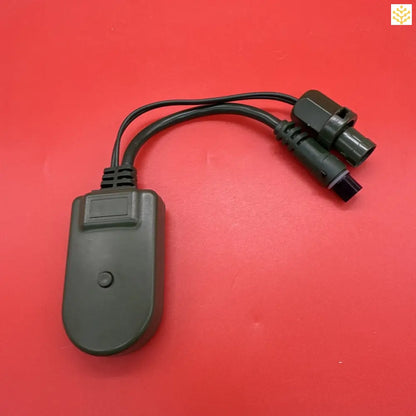 Black electronic adapter with two connecting cables.