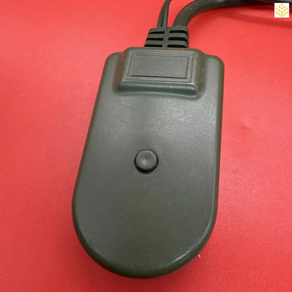 Dark gray computer mouse with a single button.