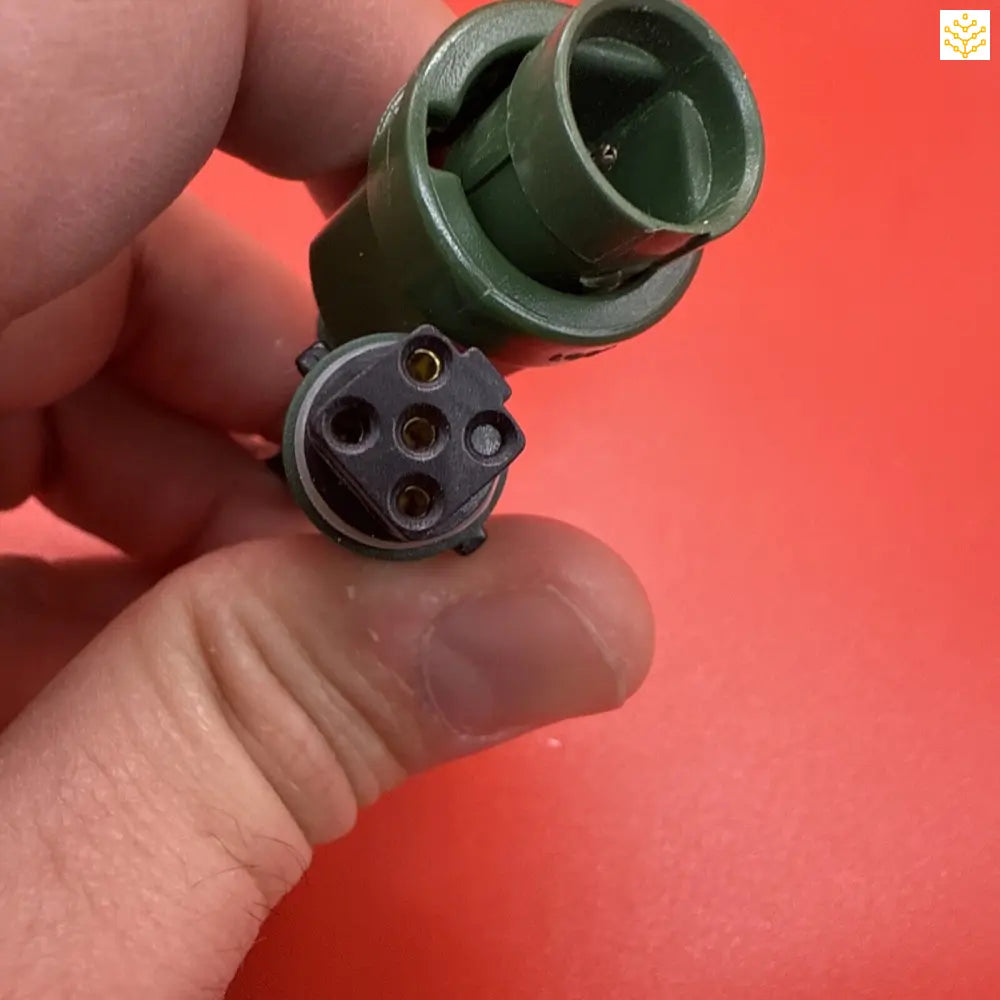 Military-style electrical connector with four pins.