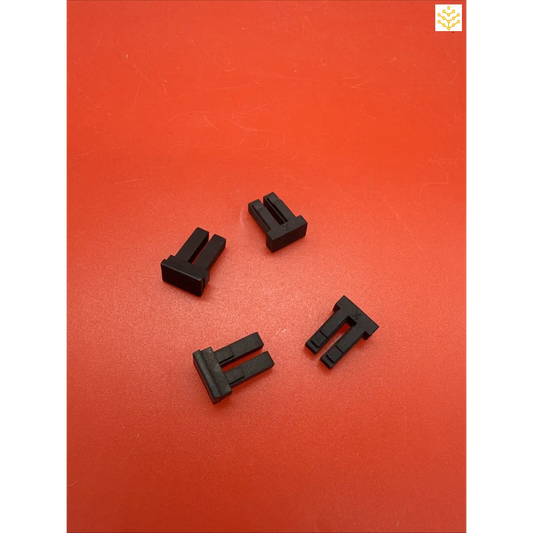 Black plastic electrical connectors or terminals.