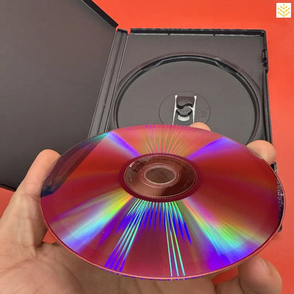 DVD or CD disc displaying iridescent rainbow colors on its reflective surface.