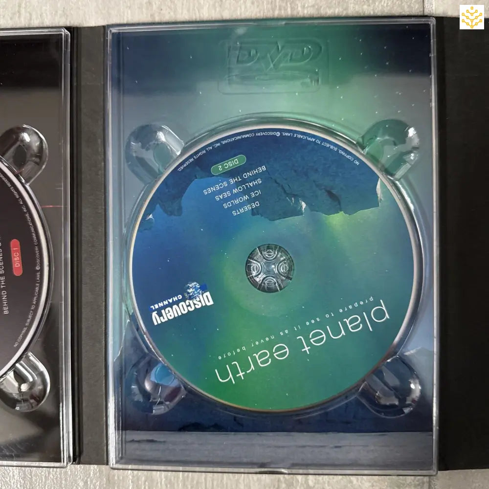 DVD or CD disc with blue and green coloring in a clear plastic case.