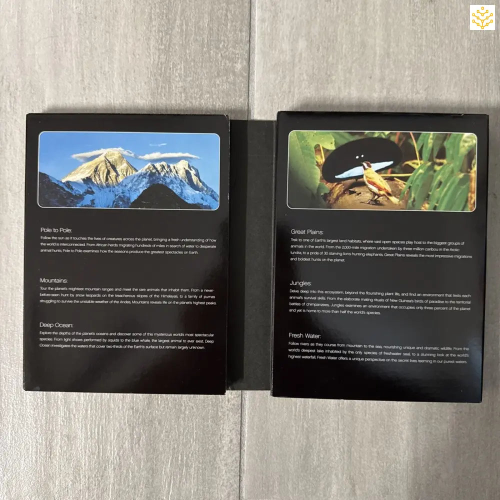 Open book or photo album displaying mountain and insect photographs with black pages and text descriptions.