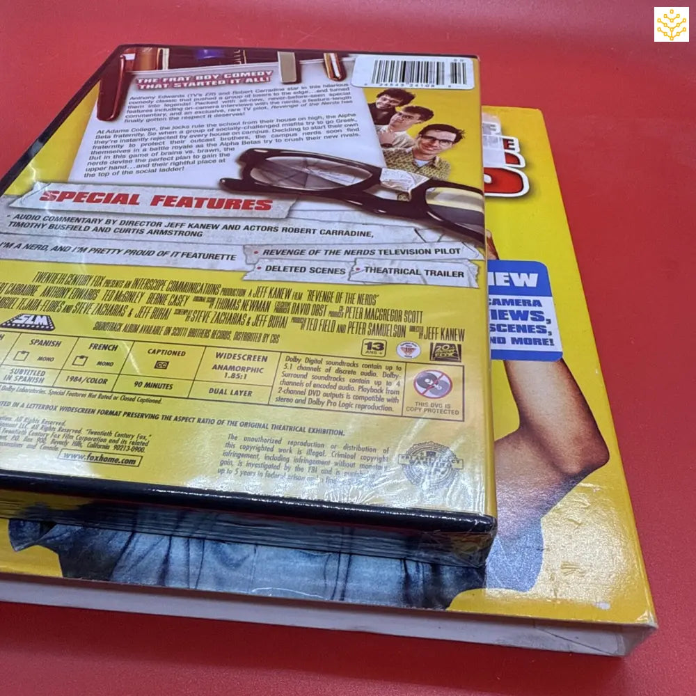 Stack of DVD cases with visible special features text and yellow packaging.