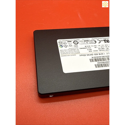 Solid-state drive (SSD) with a label displaying technical information.