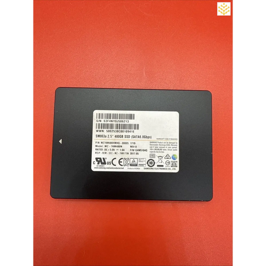 Solid-state drive (SSD) with a black casing and product label visible.