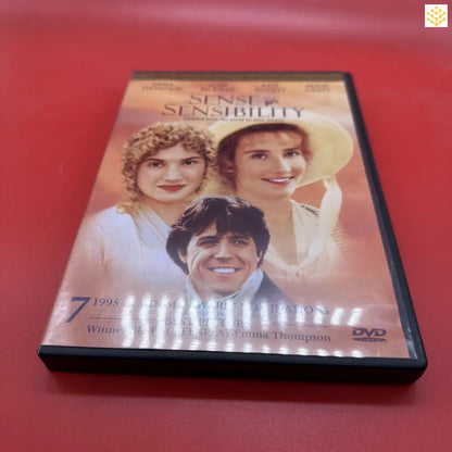 DVD case of the movie ’Sense and Sensibility’ on a red surface.