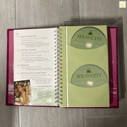 DVD collection book containing Sex and the City discs with episode guide pages.