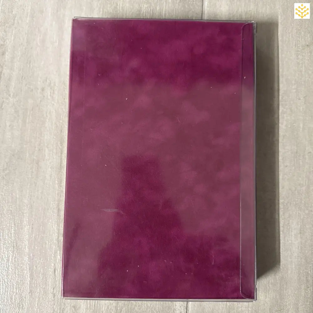 Purple hardcover book or notebook with a glossy finish.