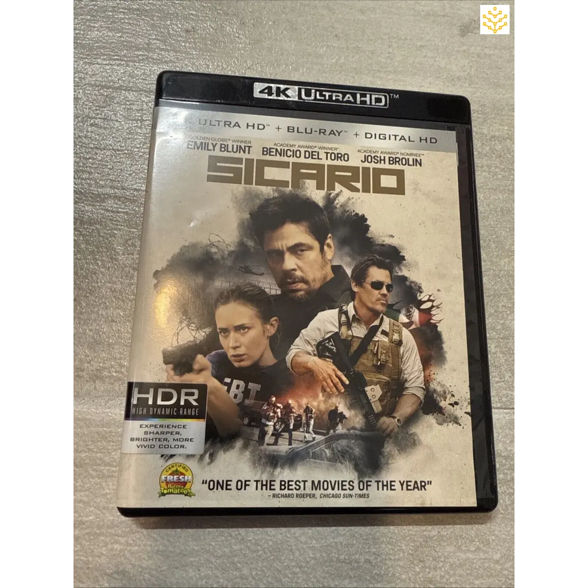 4K Ultra HD Blu-ray case for the movie ’Sicario’ featuring dramatic character portraits on the cover.