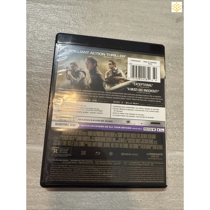 Blu-ray case for a movie titled ’Sicario’ featuring action scenes on the cover.