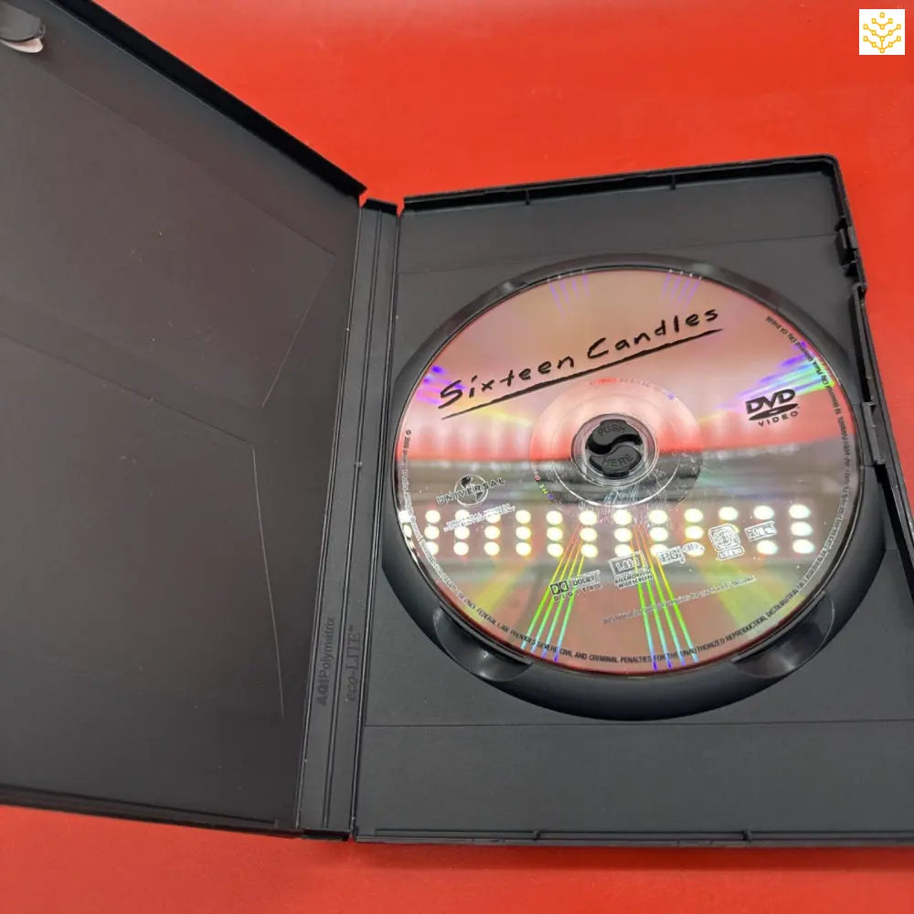 DVD disc labeled ’Sixteen Candles’ inside a black plastic case.